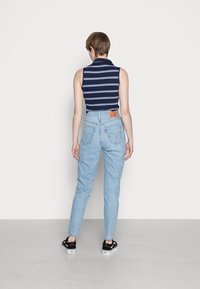 Levi's® HIGH WAISTED MOM JEAN - Mom Jeans - light-blue
