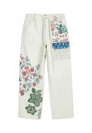 Krémové nohavice s farebnými kvetinovými potlačami na ľavej nohe a pravom vrecku s klopou, s elastickým pásom a zapínaním na gombík.