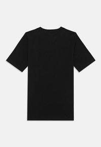 Black cotton t-shirt with short sleeves, round neckline, and a simple design. The fabric appears smooth and unembellished.