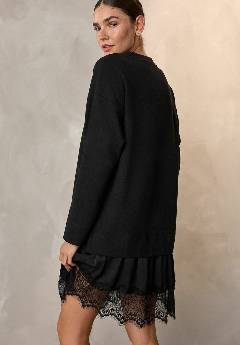 Superbe costume jupe et veste St John Santana tricot rose et