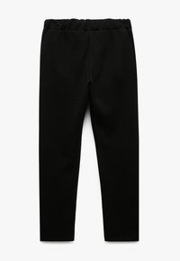 Sorte leggings lavet af blødt, strækbart stof med en elastisk talje, der har en glat tekstur og en tætsiddende, tilspidset design.