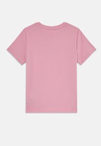 Short pink short-sleeve t-shirt in soft fabric, featuring a round neckline and minimal stitching detail on the back. No graphics or patterns.