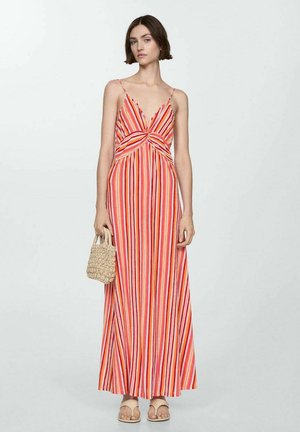 Striped maxi dress in red, pink, and white; features a twist front design, thin adjustable straps, and a flowing silhouette.
