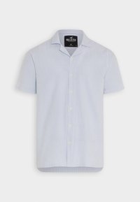 Koszula z krótkim rękawem w jasnoniebieskie i białe pionowe paski. Posiada kołnierzyk typu lapel, zapięcie na guziki oraz zaokrąglony dół. Wykonana z lekkiego materiału.