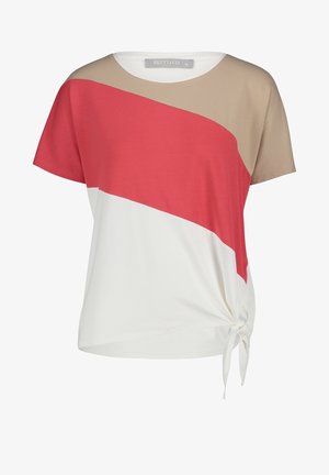 Bavlněné tričko s kulatým výstřihem, které má béžový, korálový a bílý barevný blok; obsahuje detail bočního uzlu pro přidaný styl.