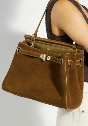 Brown suede handbag with a structured design, featuring a gold-tone hardware clasp, dual handles, and an inner zippered pocket.