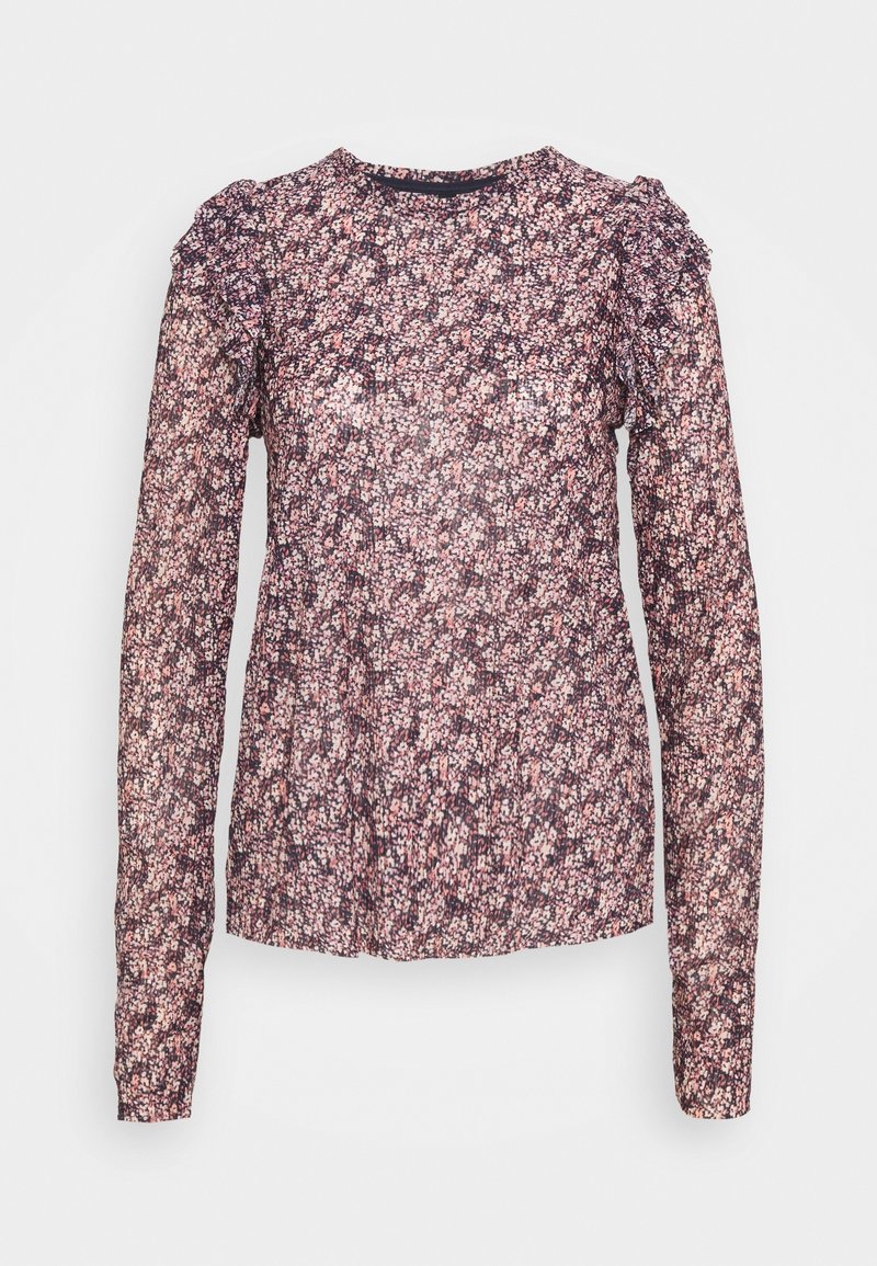 Blouse florale violette transparente à manches longues avec des détails de manches à volants et un col rond sur fond uni.