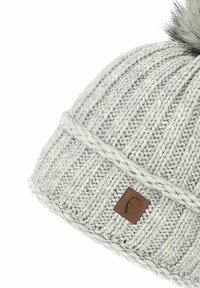 Gray knitted beanie with a ribbed texture, featuring a faux fur pom-pom on top and a small brown leather tag with a logo.