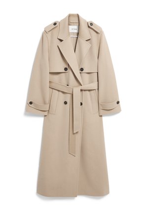 Beige wool trench coat with double-breasted buttons, shoulder epaulets, wide lapels, and a matching belt. Smooth texture and knee-length design.