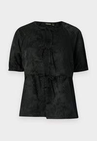 Blusa nera a maniche corte con delicato motivo jacquard floreale, tre chiusure a fiocco frontali e polsini delle maniche elasticizzati.
