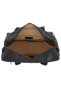 Schwarze Lederhandtasche mit weiter Öffnung, ausgestattet mit einem beigen Innenfutter und einem Reißverschluss. Hervorzuhebendes Zubehör umfasst Metallreißverschlüsse und -anhänger.