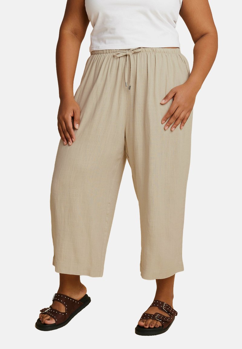 Beige, lichte, cropped broeken met een elastische tailleband en verstelbaar trekkoord. Glad oppervlak, wijde pootontwerp en subtiele glans.