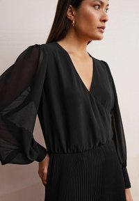 Next Maksimekko - black