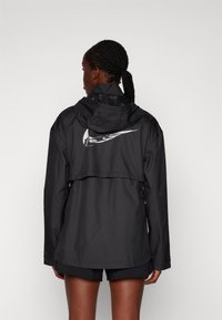 Nike Performance FAST - Windbreaker - black