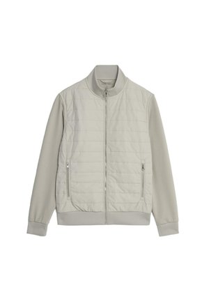 Hellergrauer Blazer mit einer gesteppte Körper und glatten Ärmeln. Er verfügt über einen Stehkragen, einen Frontreißverschluss und seitliche Taschen mit Reißverschlüssen.