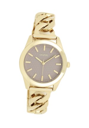 Montre bracelet dorée avec un cadran texturé gris, des index en or et un bracelet chaîné épais. Elle possède un boîtier rond et une couronne.