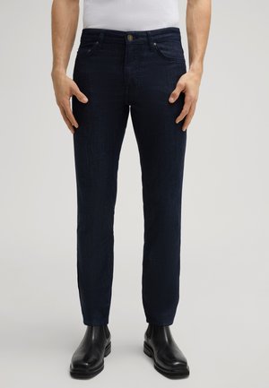 Donkerblauwe denim jeans met een slim fit, voorzien van een gladde textuur, vijf zakken, contrasterende stiksels en een metalen knoopsluiting.