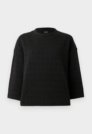 Svart genser med rund hals, senket skuldre og teksturert mønster. Laget av mykt stoff med en løs passform og tre fjerdedels ermer.