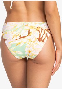 Floral print bikini bottom in pastel colors, featuring a low-rise cut, smooth texture, and a Roxy logo tag on the waistband.