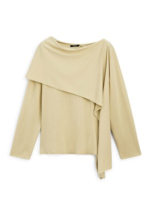 Top beige a maniche lunghe con un design asimmetrico a strati che si drappeggia sulle spalle e scende lungo un lato.