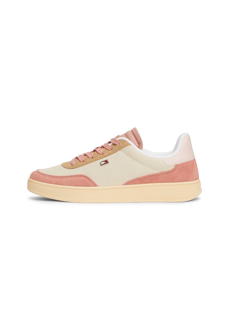 Sneaker with a white nylon upper, pale pink and tan suede accents, beige rubber sole, and matching laces. Features a small logo on the side.