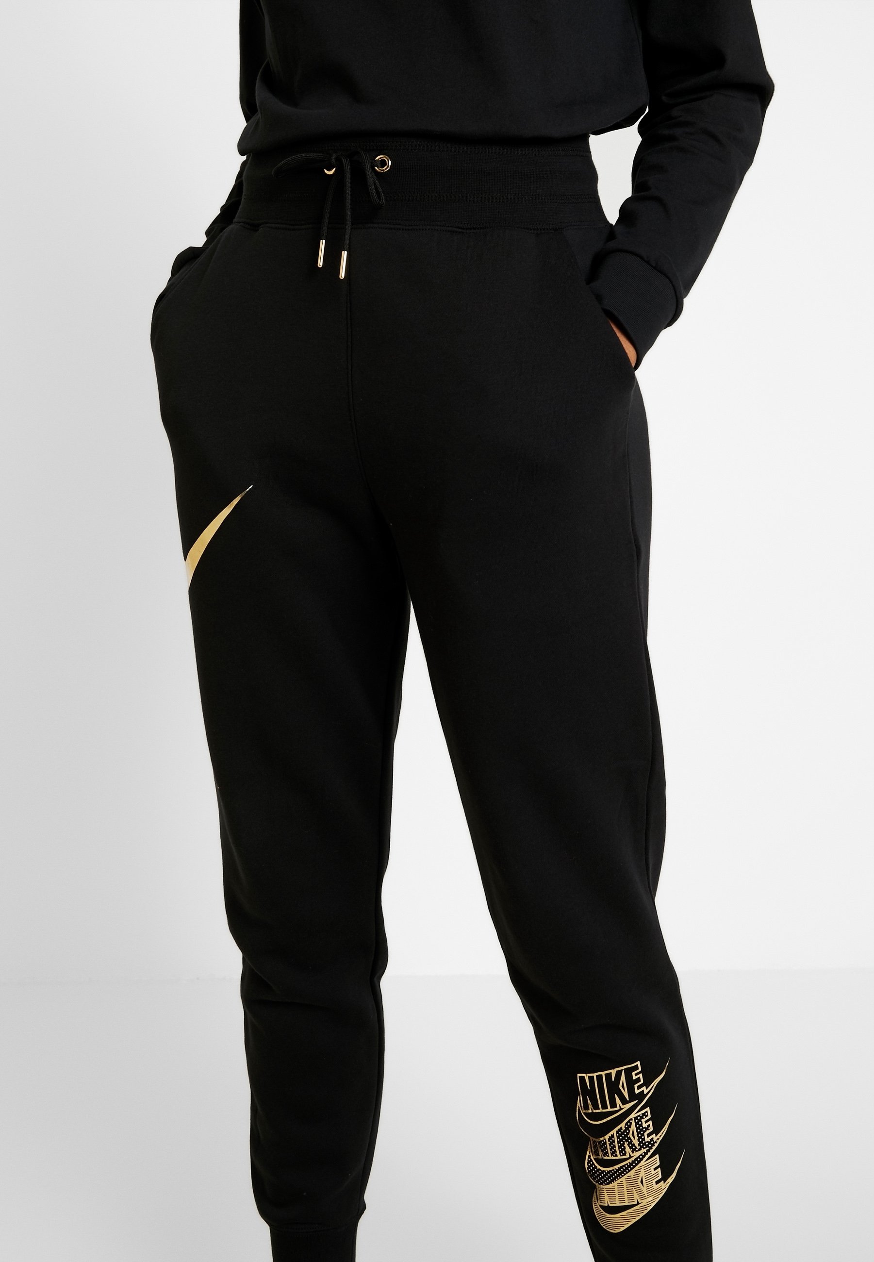 nike metallic swoosh tracksuit womens