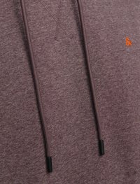 Maroon hoodie with a textured fabric. Features adjustable drawstrings with black aglets and a small orange logo on the front.