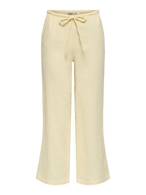 Pantalon large jaune clair avec tissu texturé et taille à cordon pour un ajustement réglable.