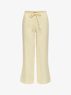 Pantalon large jaune clair avec tissu texturé et taille à cordon pour un ajustement réglable.