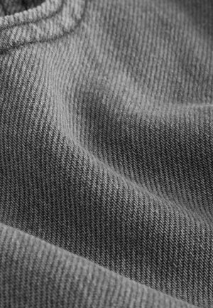 Gray knit fabric with a ribbed texture, showing subtle diagonal lines and a soft, slightly fuzzy surface. Folded creating gentle waves.