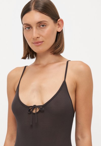 Dark brown ribbed bodysuit with a plunging neckline, thin adjustable straps, and a drawstring detail at the center front. Smooth texture.