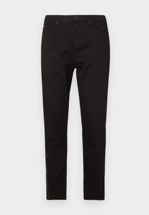 Pantaloni neri in tessuto misto cotone. Vestibilità aderente con design a cinque tasche, dotati di chiusura frontale con bottone e cerniera.