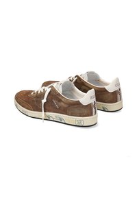 Brown suede sneakers with white leather accents, lace-up front, thick, patterned rubber soles, and branding on the sides.