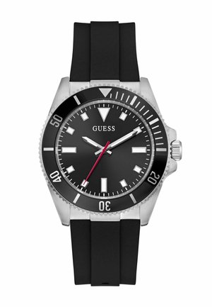 Montre analogique avec un boîtier en acier inoxydable, bracelet en caoutchouc noir, cadran noir, index des heures argentés, aiguille des secondes rouge et une lunette tournante.