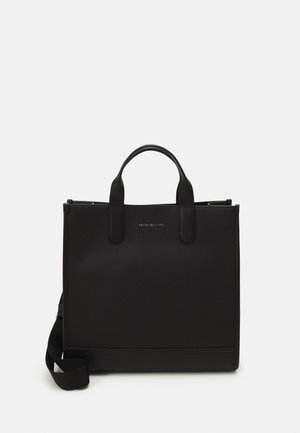 Sac cabas en cuir noir avec doubles poignées supérieures et bandoulière réglable, forme rectangulaire structurée et logo Michael Kors à l'avant.