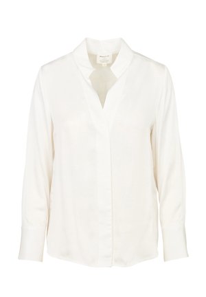 Blusa bianca a maniche lunghe con collo a V, realizzata in tessuto liscio, con patta frontale e polsini abbottonati. Senza motivi o decorazioni.