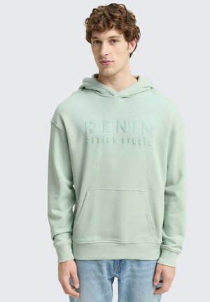Mint green hoodie with a textured finish, featuring a front pocket, adjustable hood, and “DENIM DESIGN STUDIO” embossed on the chest.