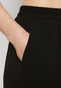 Vero Moda Tall VMALVA WIDE - Trousers - black