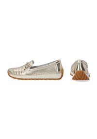 Metallic gold moccasin-style shoe with perforated design, rubber outsole, rounded toe, and bow accent on the side. Flat heel.