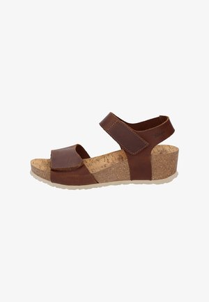 Sandali con zeppa in pelle marrone, dotati di cinturini regolabili e di una soletta in sughero, con suola testurizzata per aderenza e supporto.
