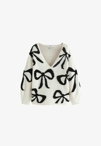 Selected, white and black tinsel bow