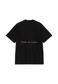 Camiseta de algodón negra con cuello redondo y mangas cortas. Texto "PAZ EN LA TIERRA" impreso en gris en la parte de atrás.