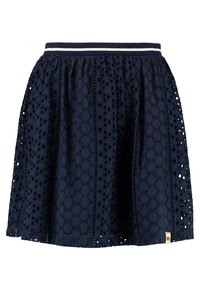 Námořnická modrá sukně z kraječkového materiálu s kruhovými výřezy, elastický pas s bílými pruhy a žlutá visačka značky na lemu.