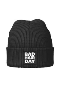 Black knit beanie with ribbed texture, featuring a folded cuff and a square patch displaying the text "BAD HAIR DAY" in bold white letters.