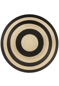 Runder Teppich mit konzentrischen Kreisen in wechselnden Schwarz- und Naturbeige-Tönen. Hergestellt aus gewebtem Material mit strukturiertem Finish.