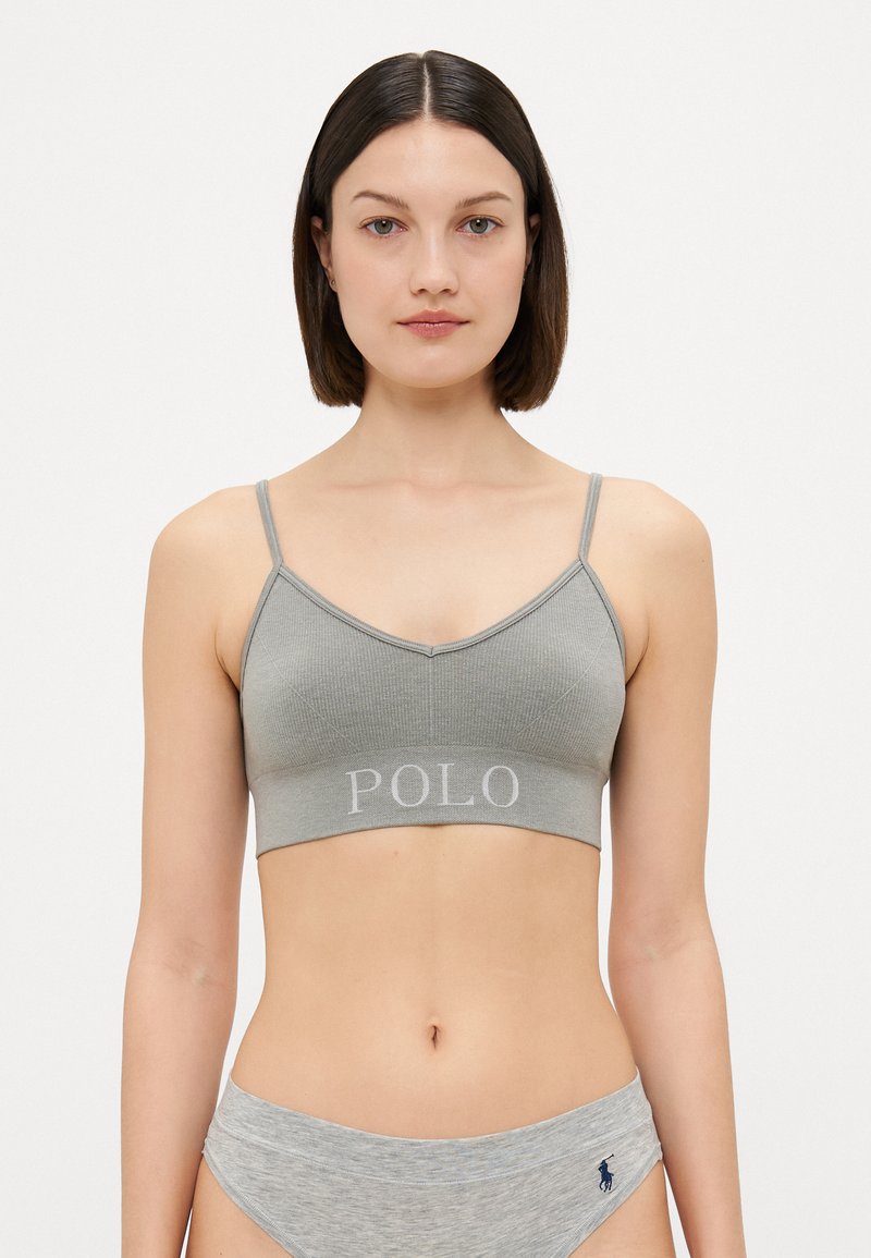 Pelēks ribots bralets ar regulējamiem siksnām un izšūtu "POLO" uz joslas. Audums ir mīksts, piemērots ikdienas valkāšanai.
