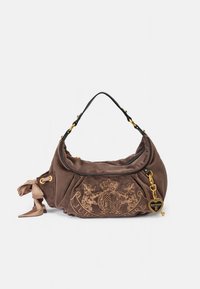 Brown suede handbag with a gathered design, gold hardware, decorative logo embroidery, a charm pendant, and a shoulder strap.