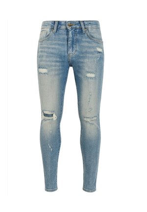 Strakke jeans van lichtblauwe denim met versleten plekken en vervaagde details. Voorzien van vijf zakken en een ritssluiting met een metalen knoop.