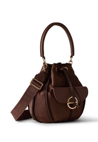 Brown textured bucket handbag with padded handle, adjustable wide strap, front flap pocket, and gold circular ring detail.