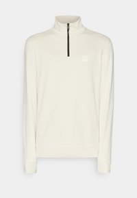 Pulovr s polovičním zipem v off-white barvě, s vysokým límcem, dlouhými rukávy a malou nášivkou na hrudi. Hladká textura.